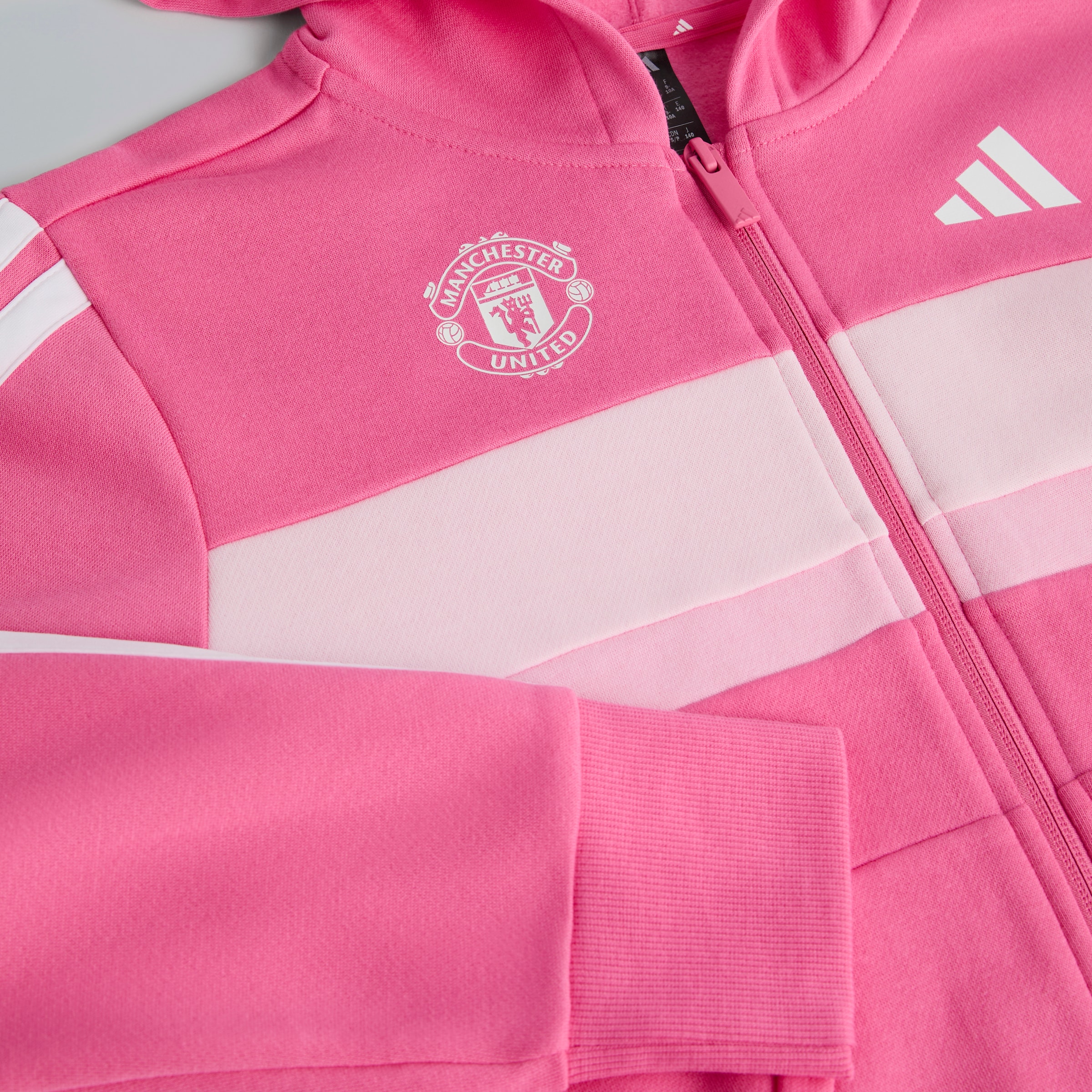 Manchester United x adidas Kids Essentials Tiberio 3-Stripes Fleece Tracksuit Pink/Black Detail [3-4]