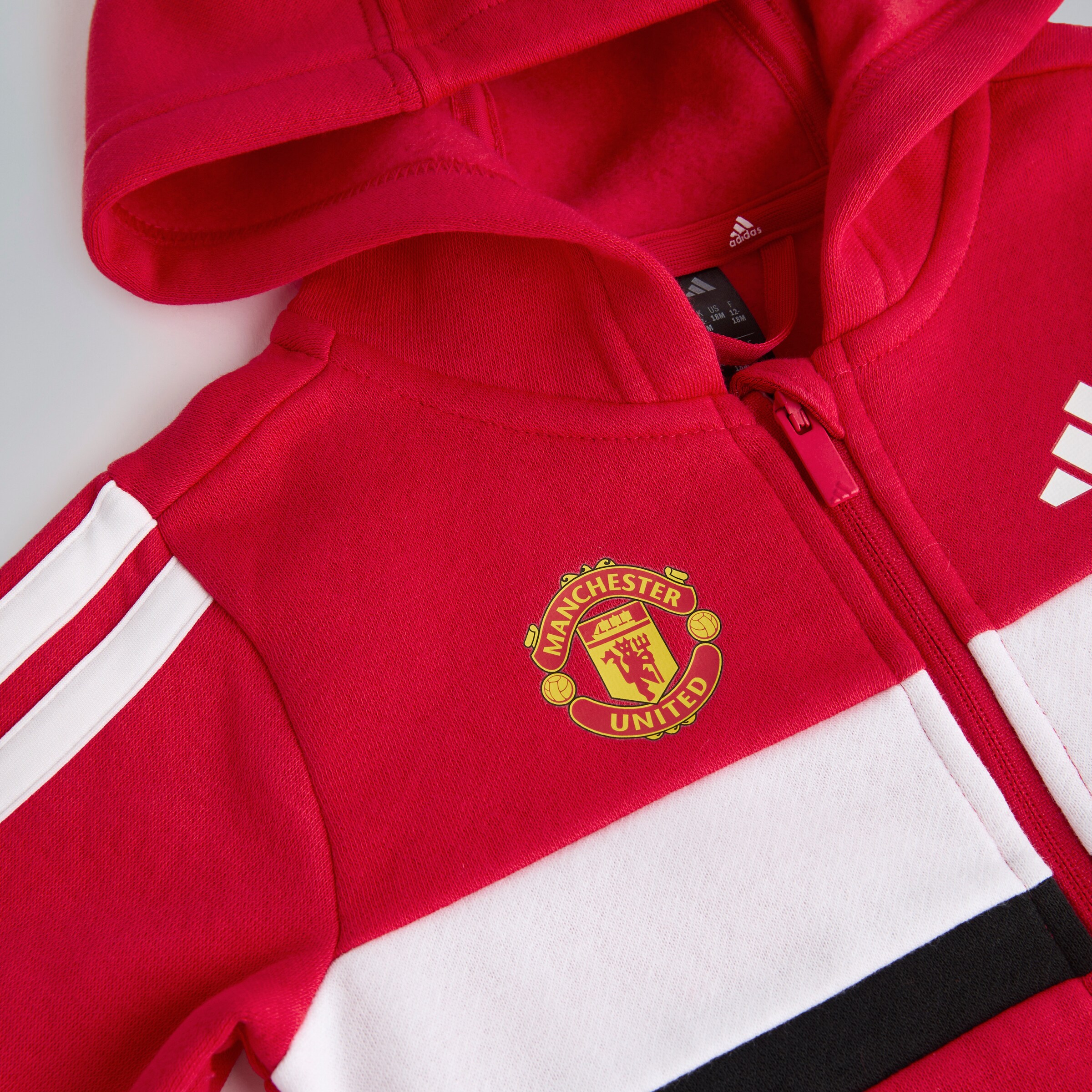 Manchester United x adidas Infant Essentials Tiberio 3-Stripes Tracksuit Red Red Detail [3-4]