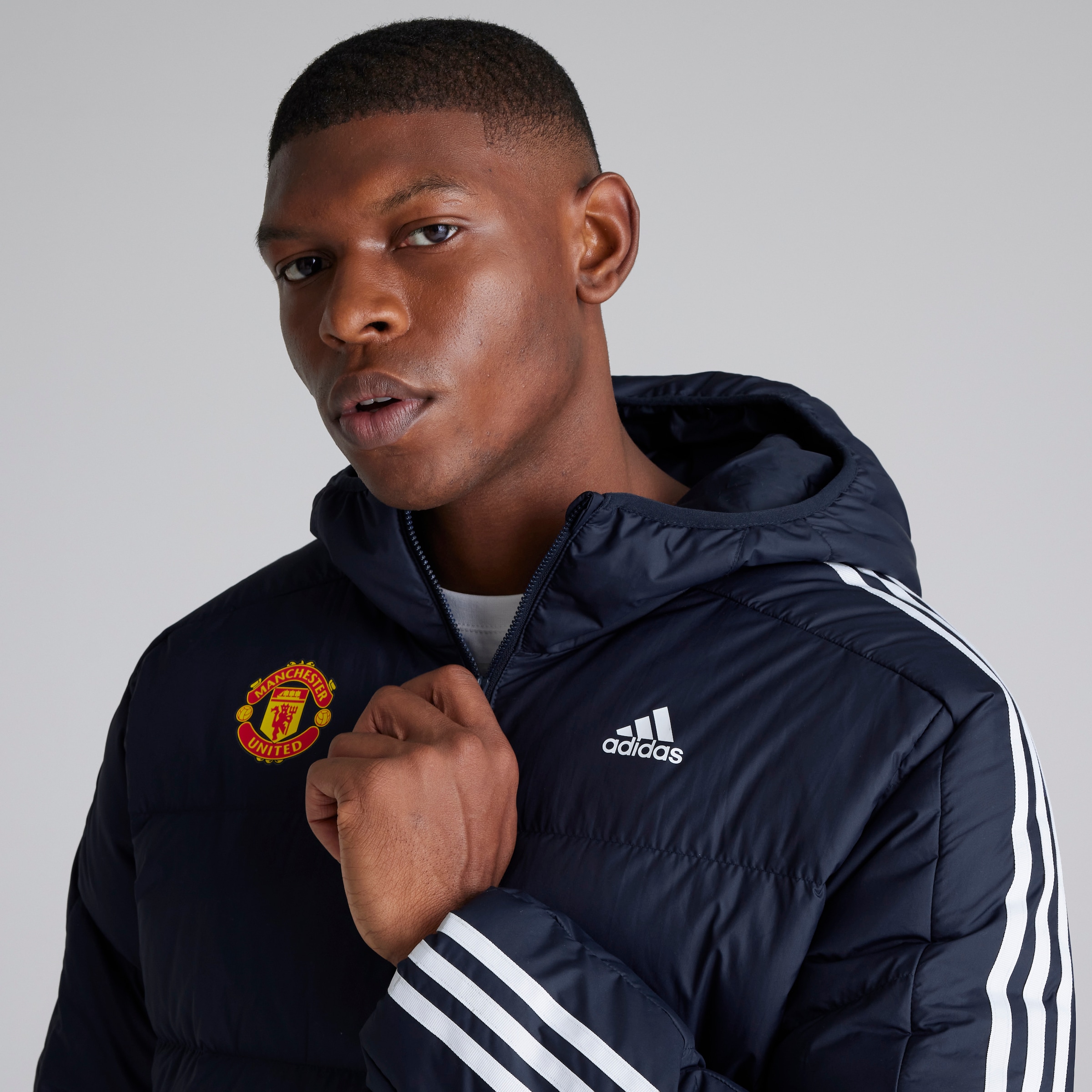 Buy Manchester United x adidas Essentials Midweight Down Hooded Jacket Navy Manchester United Store