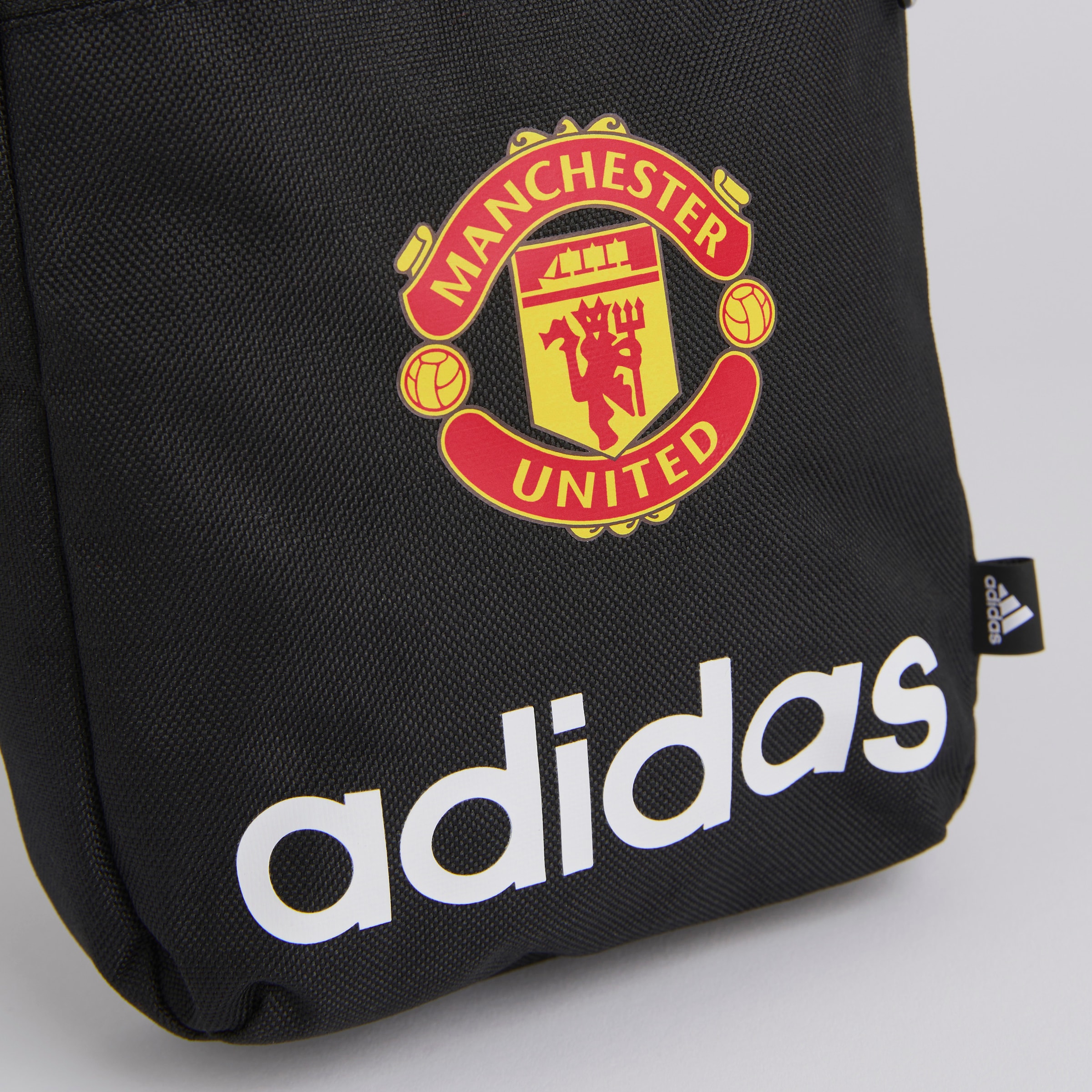 Manchester United x adidas Essentials Linear Organiser Black Black Detail [3-4]