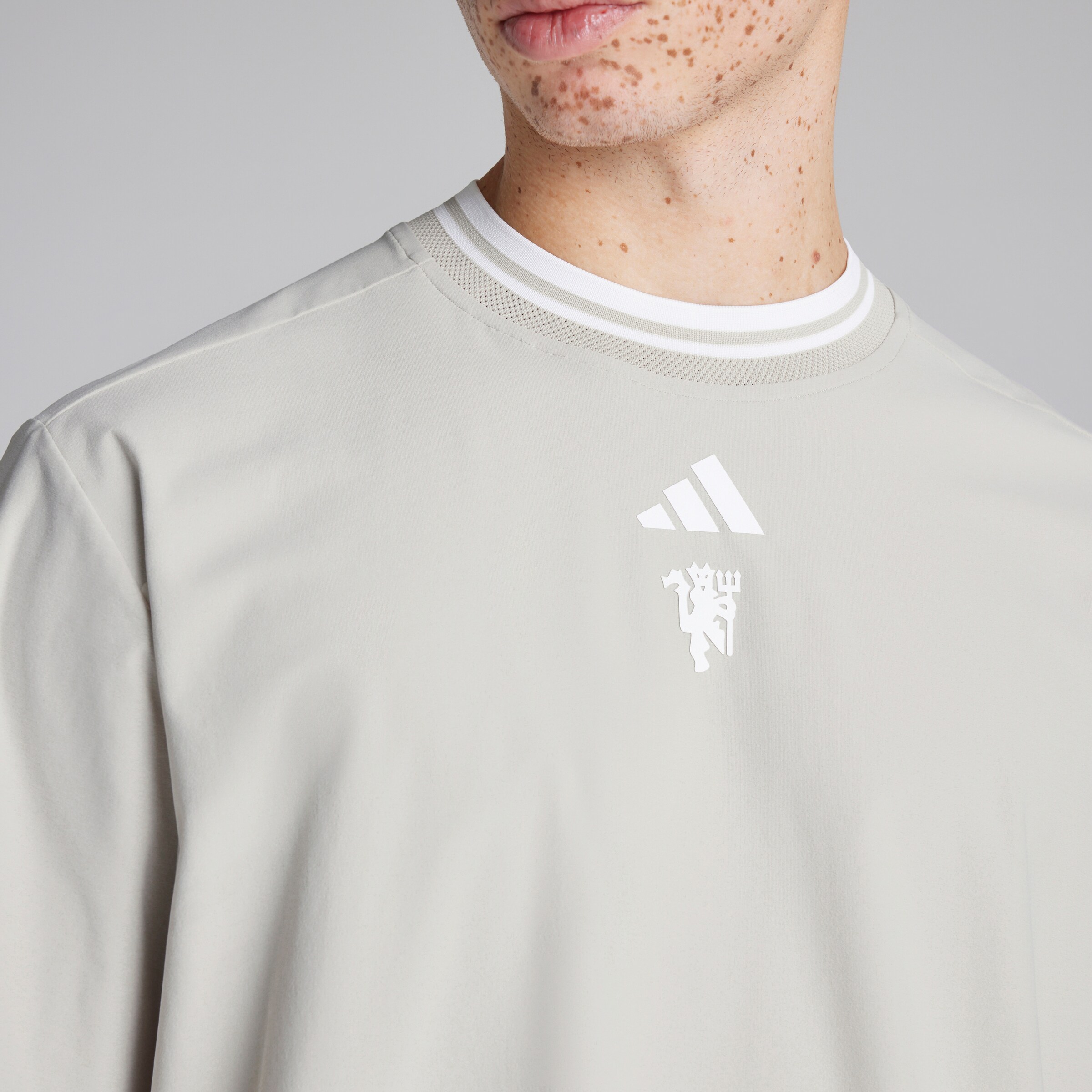 Manchester United x adidas Golf Beyond Mock Polo Shirt Beige Detail [4-5]