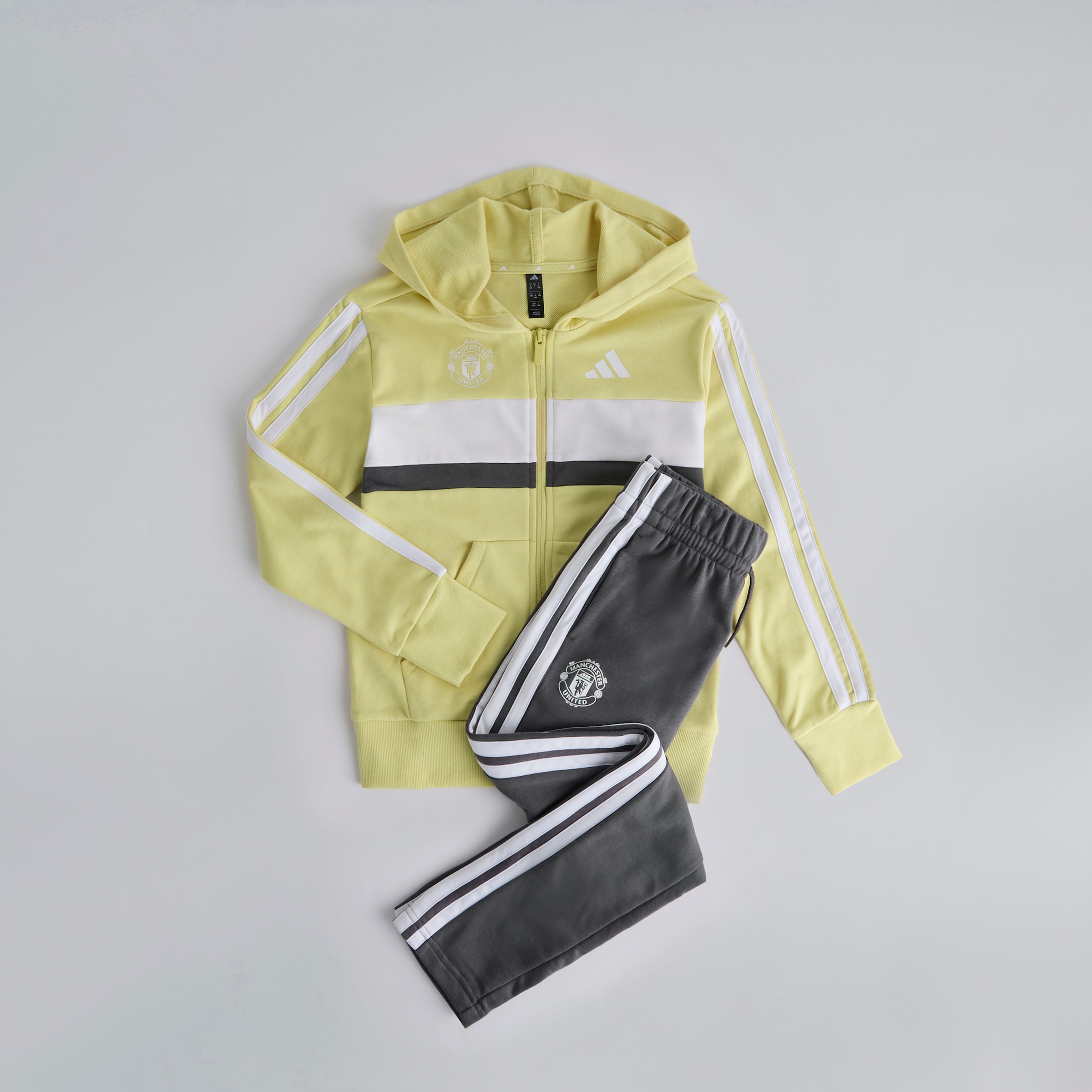 Manchester United x adidas Kids Essentials Tiberio 3-Stripes French Terry Tracksuit Yellow/Grey Yellow