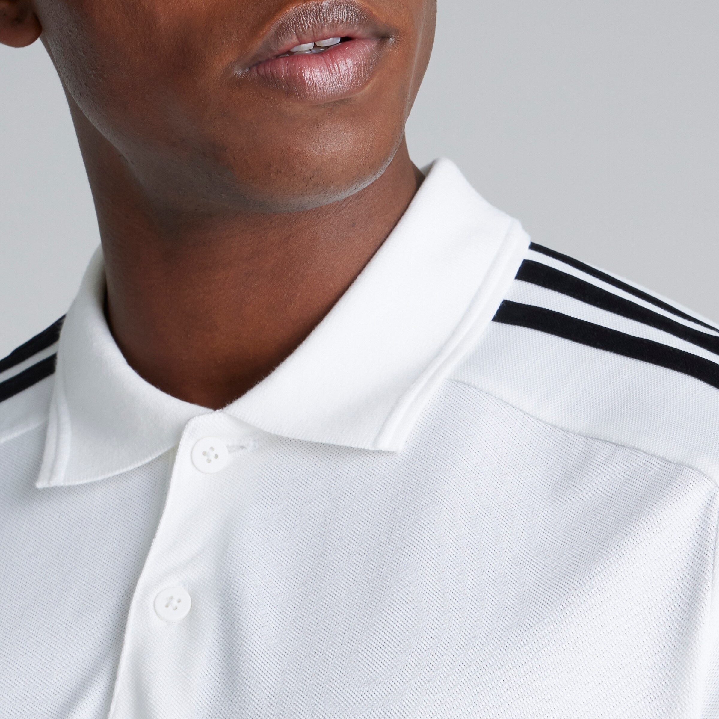 Manchester United x adidas Essentials Piqué Embroidered Small Logo 3-Stripes Polo Shirt White White Detail [4-5]