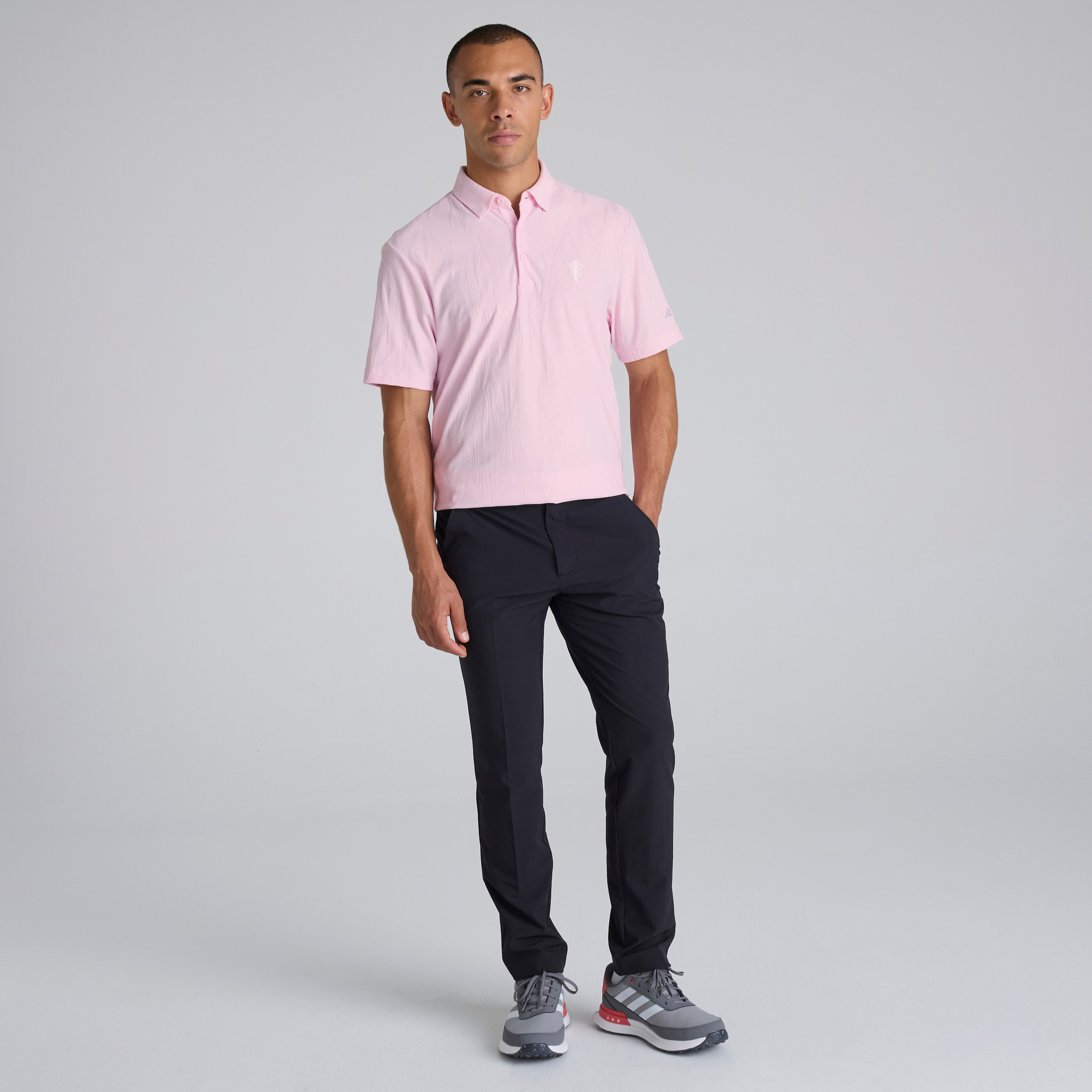 Manchester United x adidas Golf Go-To Textured Polo Shirt Pink Pink Detail [3-5]