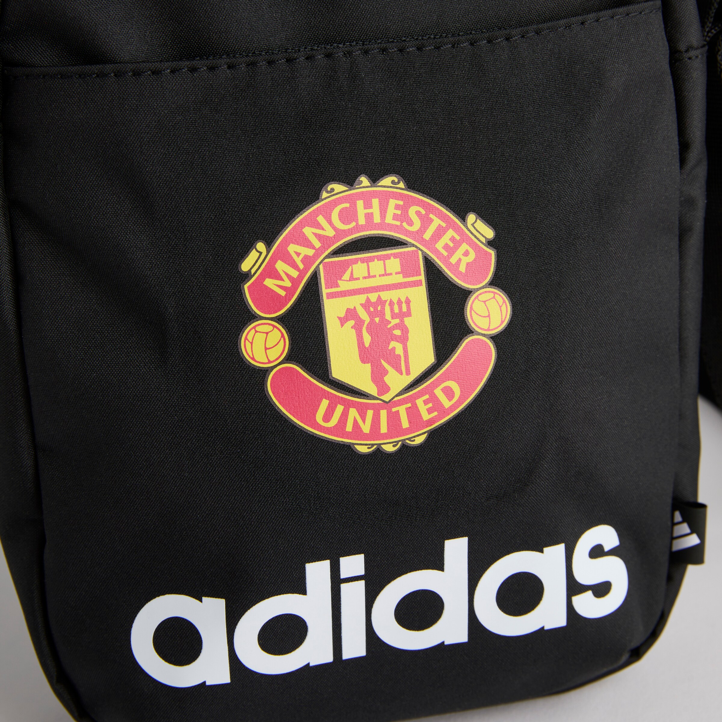 Manchester United x adidas Essentials Linear Organiser Black Black Detail [3-4]