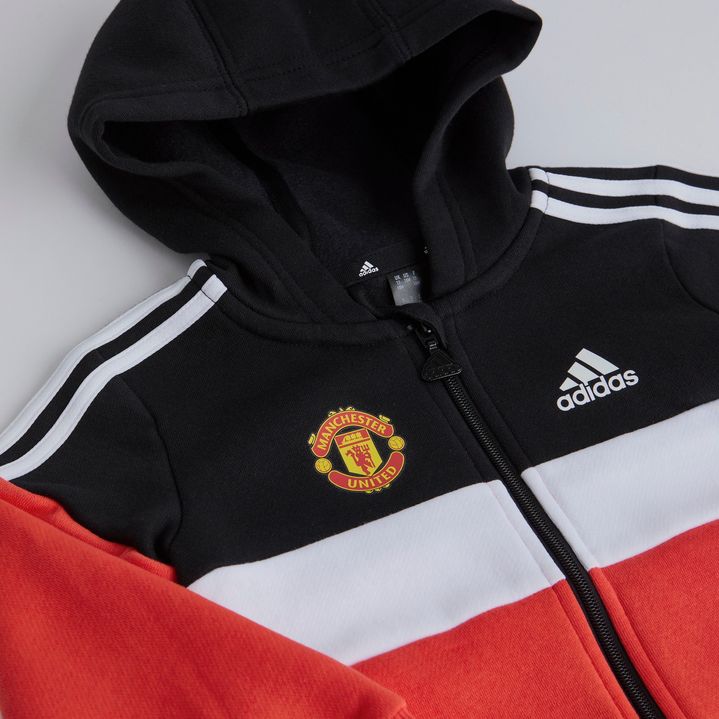 Manchester United x adidas Infant Tiberio 3-Stripes Colourblock Fleece Tracksuit Black Black Detail [3-4]
