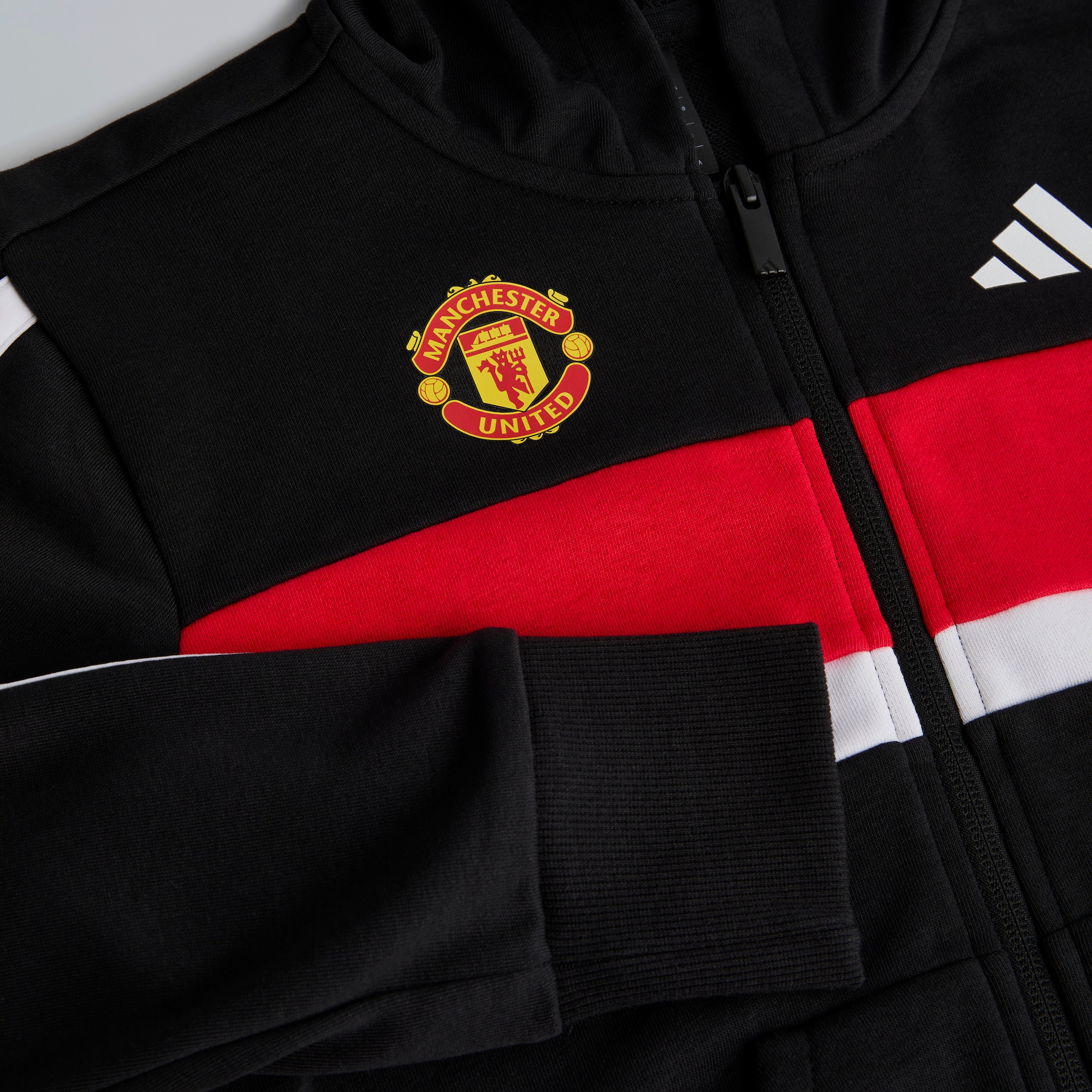 Manchester United x adidas Kids Essentials Tiberio 3-Stripes French Terry Tracksuit Black Black Detail [3-4]