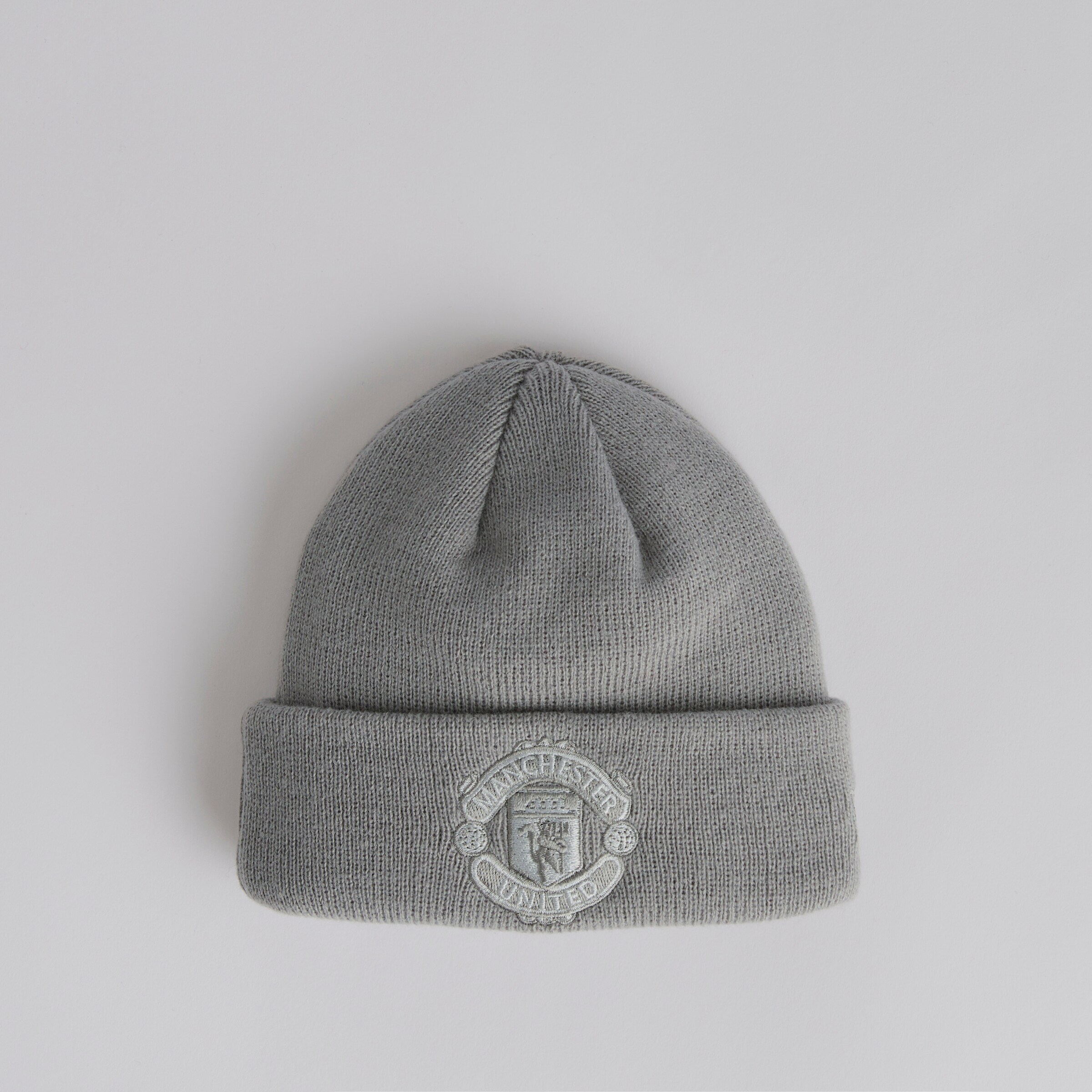 Buy Manchester United x New Era Stripe Sport Bobble Beanie Black