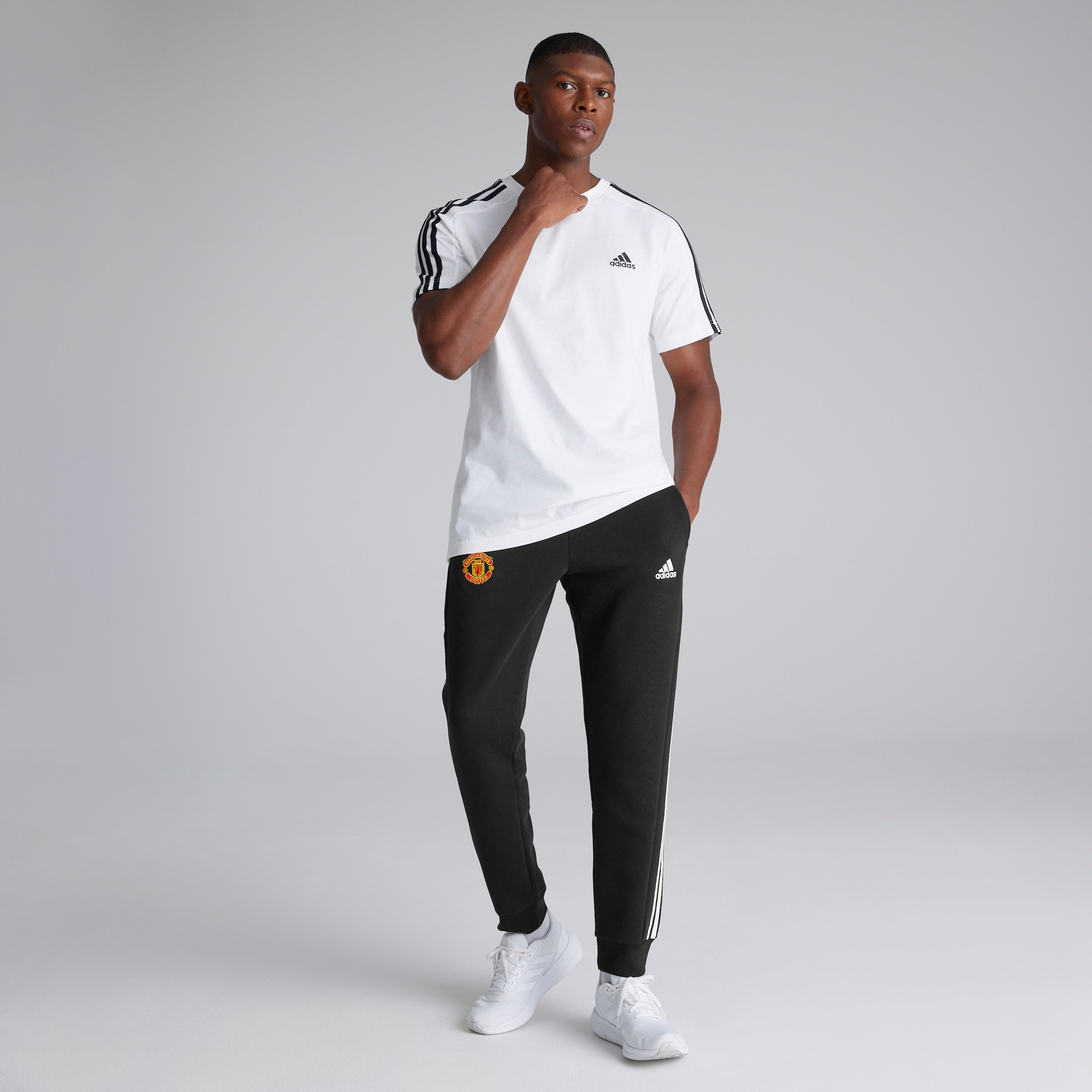 Buy Manchester United x adidas Essentials Fleece 3 Stripes Tapered Cuff Joggers Black Manchester United Store