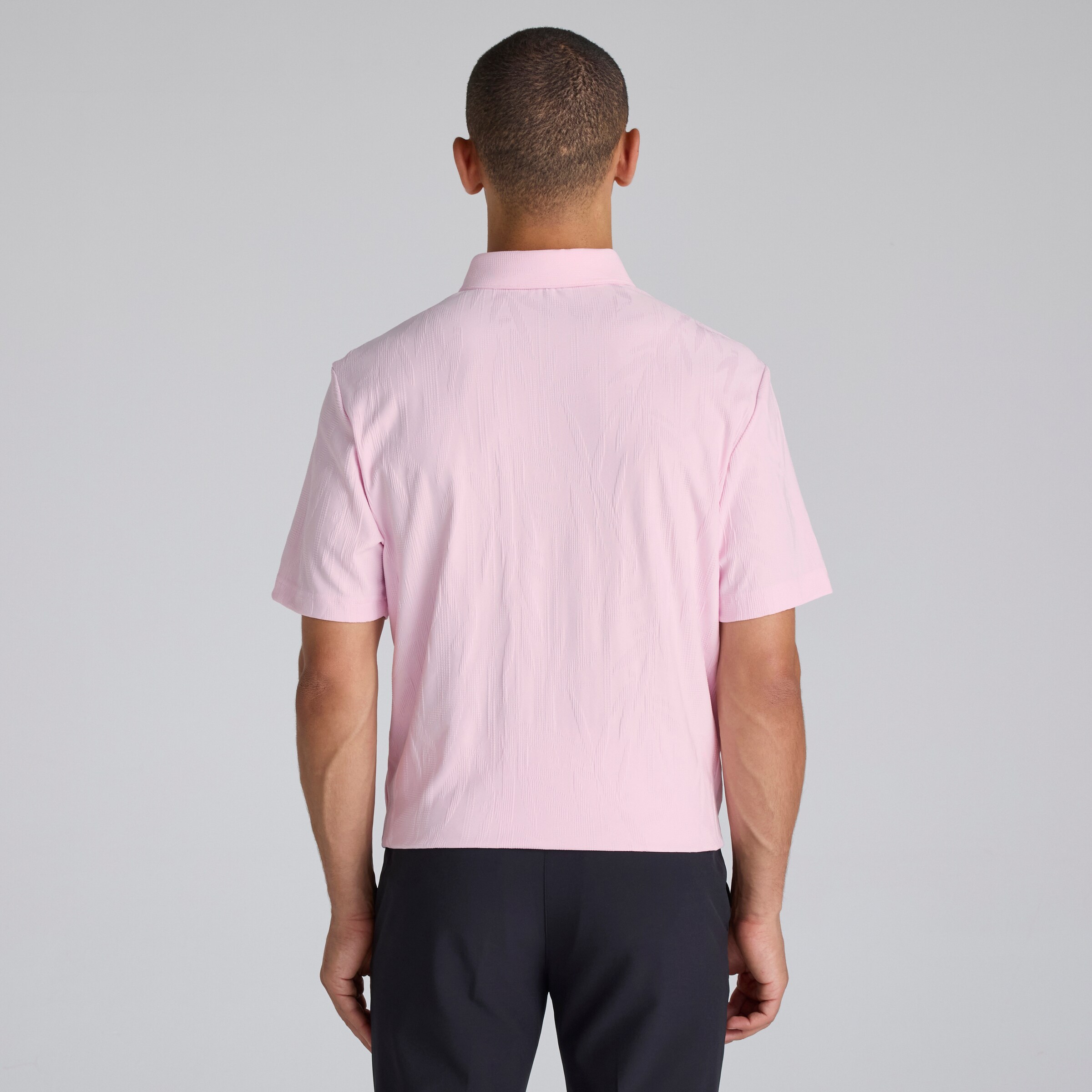 Manchester United x adidas Golf Go-To Textured Polo Shirt Pink Pink Detail [2-5]